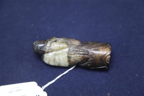 A Chinese white and black jade figure of a sage, possibly Han dynasty, height 9.1cm, wood stand